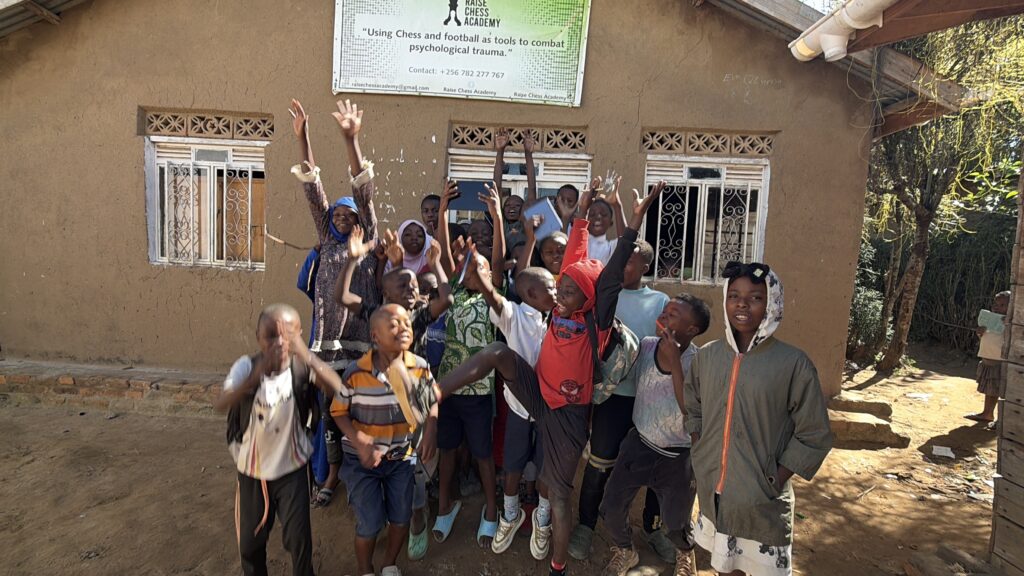 Children celebrating with the chess-loaded tablets